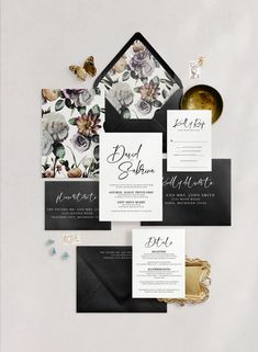 black and white wedding stationery with flowers