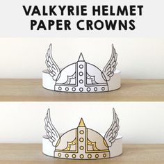 two paper crowns with wings on them and the words valkyrie helmet paper crowns