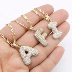 "CZ Bubble Initial Letter Chain & Pendant Necklace Set Real 10K Yellow Gold * MetalReal 10K Yellow Gold (Properly Stamped, 10K)  * ConditionBrand New  * FinishPolished  * Average Weight : 16\" : 6.26 grams  18\" : 6.67 grams  20\" : 7.08 grams  22\" : 7.49 grams  24\" : 7.90 grams  * Length : Chain: Selectable  Pendant: Approx. 1\"  * Width : Chain: 2.5mm  * Clasp/Bail : Lobster Lock" 14k Yellow Gold Iced Out Necklace, Anniversary Initial Pendant Chain Jewelry, Anniversary Jewelry With Initial Pendant Chain, Anniversary Chain With Initial Pendant, Anniversary Initial Pendant Chain, Iced Out Yellow Gold-plated Necklaces, Gold Iced Out Round Necklace, Iced Out Round Gold Necklace, Gold Bling Necklaces For Valentine's Day