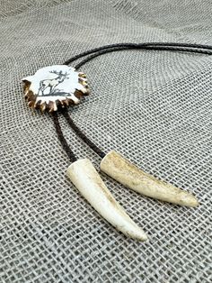 Please note: Every antler is unique, ensuring that no two bolo ties are exactly alike. The bolo tie you receive may differ from the photo, showcasing the natural variations and distinct charm of each piece. Embrace the individuality and spirit of nature with this one-of-a-kind, timeless jewelry. Unlock the essence of strength, courage and goodluck with our original antler bolo ties. This original antler bolo tie is outstanding accesory. Can be perfect gift for best friend, boyfriend, brother, husband, father, grandfather, cooworker, boss. Our bolo ties are more than just accessories - they embody the powerful symbolism of antlers, representing strength, courage, and the cyclical nature of life. Adorn yourself or a loved one with a talisman that brings good luck and protective energies. - U Deer Antler Ring, Best Friend Boyfriend, Antler Jewelry, Antler Ring, Bolo Ties, Deer Print, Bolo Tie, Gift For Husband, Exclusive Gift