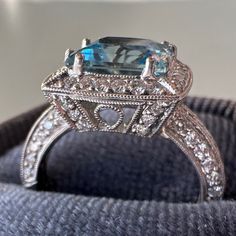 Simon G Beautiful Diamond & Aquamarine 18k Wg Ring .88 Tcw In Diamonds Aquamarine Gem Is Approx. 8mm X 8mm The Aqua Color Saturation Is Phenomenal! It Is Hallmarked On Inside Of Band Simon G, 18k ~ And I Believe .88 And 2.04 Because Very Faint/Partial Missing & Hard To Read. Screen Shot Of "Similar" Shown For Price Reference Only Size 4.25 New Cond. Please See All Photos. Luxury Diamond White Topaz Ring, Luxury Cushion Cut Sapphire Ring With Vvs Clarity, Gia Certified Cushion Cut Sapphire Ring In White Gold, Luxury Diamond Topaz Ring For Anniversary, Luxury Aquamarine Diamond Ring With Prong Setting, Luxury Topaz Ring With Prong Setting, Luxury White Gold Ring With Aquamarine, Luxury Diamond Topaz Anniversary Ring, Luxury Diamond Anniversary Topaz Ring