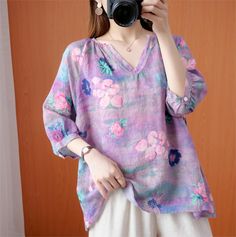 Details: Type: Women Loose V-Neck Printed Linen Shirts Material: Linen Sleeve Length: Three-Quarter Sleeves Pattern: Printed Color: Purple, Pink, Red Style: Loose Size Bust Shoulder Sleeve Length (min) Length (max) cm inch cm inch cm inch cm inch cm inch L 124 48.82 58 22.83 11 4.33 65 25.59 73 28.74 XL 128 50.39 59 23.23 11.5 4.53 66 25.98 74 29.13 Cotton V-neck Shirt With Floral Print, Multicolor V-neck Shirt, V-neck Floral Print Relaxed Fit Shirt, Casual Multicolor Split Neck Top, Multicolor Split Neck Casual Top, Pink Relaxed Fit V-neck Shirt, Purple V-neck Summer Shirt, Casual Red Split Neck Top, Purple Cotton V-neck Blouse