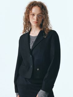 Editor's NotesThe tailored short jacket is made with TR twill fabric. The jacket has voluminous sleeves with meal logo symbol as an accent. - 2 button notched collar design- For semi-formal or formal occasion- Simple and stylish lookMeasurements(in.)ONE SIZE (XS-M)- Length: 20.28 in.- Shoulder: 19.69 in.- Chest: 20.08 in.- Bottom Hem: 17.91 in.- Sleeve Length: 22.24 in.- Sleeve Width: 7.48 in.- Sleeve Hem: 5.31 in.*Model size: Height 5'91, Bust 32, Waist 25, Hip 35*Model size: Height 5'68, Bust 32, Waist 24, Hip 34*Model size: Height 5'71, Bust 32, Waist 23, Hip 35*Model size: Height 5'61, Bust 30, Waist 24, Hip 35*Size is based on cross-section, and errors may occur depending on the measurement method and location.Composition & Care- Shell: 80% Tencel, 16% Rayon, 4% Spandex &nbsp Semi-formal Notch Lapel Outerwear For Office, Semi-formal Office Lady Outerwear With Button Closure, Semi-formal Single-breasted Outerwear For Office, Semi-formal Single-breasted Office Outerwear, Black Business Casual Blazer For Office, Black Office Lady Blazer For Business, Black Office Lady Blazer For Business Casual, Elegant Cropped Jacket For Winter Workwear, Elegant Cropped Winter Jacket For Work