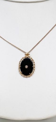 "The past will always return in the fashion world and this piece is back for round two! In the 1920's ladies of class wore the most opulent dresses with jewelry to match. As the years continued, jewelry makers tailored pieces to fashion and trends which resulted in affordability for style. Presenting this Beautiful Vintage 10k Gold Black Onyx Seed Pearl Pendant With Complimentary 10k Chain Necklace Featuring Elegant Twisted Rope Trim Designs. Approximate Size: Chain Measures 16.00\" Long, Pendan Antique 14k Gold Curb Chain Jewelry, Antique Curb Chain Necklace For Formal Occasions, Antique Curb Chain Necklaces For Formal Occasions, Vintage 14k Gold Necklaces With Curb Chain, Vintage 14k Gold Curb Chain Necklaces, Vintage 14k Gold Curb Chain Necklace, Formal Onyx Oval Necklace, Elegant Medallion Necklaces With Curb Chain, Elegant Medallion Curb Chain Necklaces