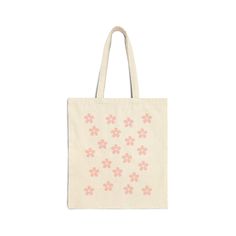 This 100% cotton bag comes in one size - 15" x 16"- perfect for everyday wear. While the canvas material will show off your designs in great colors, it's durable and will last for years. The bag features 20" handles (made from the same canvas), making it easy to carry even with a week's worth of shopping.\n.: 100% cotton canvas\n.: Heavy fabric (12 oz/yd² (406.9 g/mn.: Sewn-in label\n.: Available in natural and black colors Eco-friendly Cotton Bags For Spring, Pink Cotton Bags For Spring, Pink Cotton Shoulder Bag For Spring, Spring Pink Cotton Shoulder Bag, Spring Cream Cotton Shoulder Bag, Pink Eco-friendly Cotton Bag, Eco-friendly Pink Cotton Bag, Cotton Flower-shaped Bag For Daily Use, Eco-friendly Pink Cotton Bags