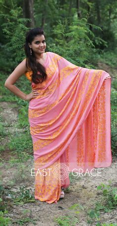 Featuring a coral pure georgette saree from EAST & GRACE with orange gingko leaf rows on pallu and skirt of the saree. It comes with an unstitched orange sleeveless blouse. Visit www.eastandgrace.com. Price: RS.13,000. Saree Collection Latest, Designer Embroidery, Desi Love, Pure Georgette Sarees, Minimal Look, Online Saree, Georgette Saree, Work Looks, Georgette Sarees