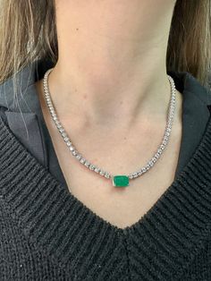 This very requested and popular tennis necklace is an absolute beauty. Elevate the look of a classic Tennis Necklace with a beautiful Emerald center Stone for a more unique piece. You will definitely not want to take off this gorgeous piece, it can be dressed up or down depending on how you wear .  Material: Solid 14K White Gold Diamonds: Round Cut, Prong Setting  *These are 100% Natural Earth Mined Diamonds. Carat: Approximately 2.50Ct Emerald Center Stone- 8.50Ct Round Diamond Side stones  Col Classic Diamond Tennis Necklace With Gemstones, Formal White Gold Tennis Necklace With Gemstone, Formal Single Strand Emerald Necklace, Formal Cubic Zirconia Tennis Necklace With Gemstones, Luxury Round Gemstone Tennis Necklace, Elegant Round Gemstone Tennis Necklace, Elegant Gemstone Tennis Necklace, Formal Gemstone Tennis Necklace, Round Gemstone Tennis Necklace Fine Jewelry