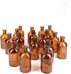 a group of brown glass bottles sitting next to each other