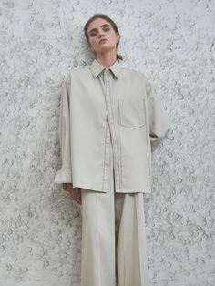 Embrace refined comfort with our Frankie Oversized Shirt, an essential for those who like to be at the vanguard of modernity. Tailored for an oversized fit, this shirt showcases topstitching details and a mid-weight fabric that perfectly blend style and functionality. Secured at the front with multiple buttons, it refl Modern Workwear Shirt With Welt Pockets, Modern Shirt With Welt Pockets For Work, Modern Shirt With Concealed Placket For Work, Modern Boxy Fit Tops For Workwear, Modern Relaxed Fit Shirt With Placket, Modern Shirt With Relaxed Fit And Placket, Modern Shirt With Placket And Relaxed Fit, Oversized Shirt With Concealed Placket For Fall, Oversized Tops For Workwear With Straight Hem