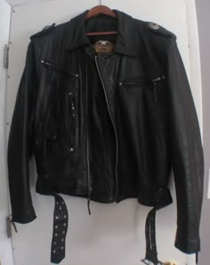 70's inspired 90's Harley Davidson leather jacket Total of 7 pockets, studded belt Conch detail on shoulders Harley Davidsons logo debossed on back Made in USA Good Condition, soft vintage leather Size XL Shoulders- 21 inches Armpit to armpit - 26 inches Waist - 23 inches Length - 26 1/2 inches Sleeve inseam - 19 inches Leather Outerwear With Rivets For Biker Events, Leather Jacket With Rivets For Biker Events, Retro Leather Biker Jacket With Pockets, Vintage Leather Jacket With Pockets For Biker Events, Harley Davidson Leather Jackets, Studded Leather Jacket, Harley Davidson Logo, Studded Belt, Swaggy Outfits