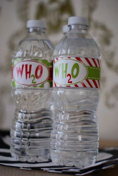 two bottled water bottles sitting next to each other