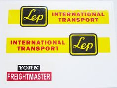 stickers on the side of a white board with black and yellow letters that read, leap, international transport, york freight center