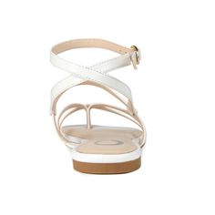 The Serissa sandals by Journee Collection are the ultimate summer go-to. This foot-framing fit features slender vegan leather crisscross straps and a dainty buckle closure. A tiny block-heel and a heavenly padded footbed finish this warm-weather companion. At Journee Collection our sandal styles are going to be perfect for any occasion. Whether that be a formal business or casual dress these sandals will be a perfect match. Summer Strappy T-strap Sandals With Buckle Closure, Strappy Slingback Sandals With Cushioned Footbed For Summer, Summer Strappy Slingback Sandals With Cushioned Footbed, Chic Synthetic Cross Strap Sandals, Chic Synthetic Cross-strap Sandals, Synthetic Strappy Open Toe Sandals, Strappy Summer Wedge Sandals With Buckle Closure, Summer Strappy Wedge Sandals With Buckle, Summer Strappy Sandals With Buckle Closure