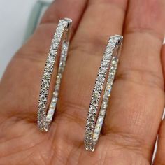 $2100 -$300 12/7/2023 Stunning Diamond Hoop Earrings White Gold.  There's diamonds set on the outside and Inside of the hoop.  Simple and Stylish earrings to wear on any occasion.  Excellent craftsmanship, the diamonds are very sparkling.  The lock on these earrings are very secure and easy to take on and off.  You need to push down on the lever to release the earrings, so it's not easy to lose these earrings.  The oval shape looks flattering on.  Nice size hoops, not too big or small.  Measures about 35.9 x 29.3mm.  About 2.1mm width.  Special price one pair only.   Genuine Round Brilliant Cut Diamonds  Total weight: 2.01 carats All white and shiny Diamonds  Clarity: SI  Color: G/H/I All 68 sparkling diamonds, no cloudy stones  Solid 14K White Gold 7.9 grams  Comes with gift box * We have Luxury Oval Diamond White Hoop Earrings, Oval Hoop Earrings In Diamond White With Brilliant Cut, Luxury Oval Hoop Earrings With Diamond Accents, Diamond White Oval Hoop Earrings With Prong Setting, Oval Diamond White Hoop Earrings Fine Jewelry, Oval Cubic Zirconia Hoop Earrings With Halo Design, Oval Diamond Hoop Earrings In White Gold, Oval Halo Design Cubic Zirconia Hoop Earrings, White Gold Diamond Hoop Earrings With Oval Shape