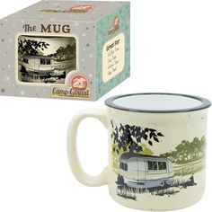 a coffee mug with the image of a camper on it next to a box