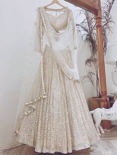 <ul>
<li style="text-align: justify;"><span data-preserver-spaces="true">Let your elegance reflect and get compliments with this beauty. This white lehenga is made of georgette material beautified with sequins work, and thread embroidered.</span></li>
<li style="text-align: justify;"><span data-preserver-spaces="true">This lehenga comes with a similar color georgette material blouse designed with sequins work, and thread embroidery, and a similar color n White Lehenga Choli, Sequence Lehenga, Gold Lehenga, Ghaghra Choli, Paper Border, Lehenga Choli For Women, White Lehenga, Choli For Women, Sabyasachi Lehenga