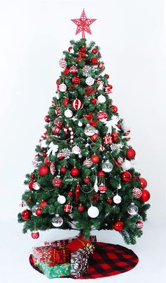 a small christmas tree with ornaments on it