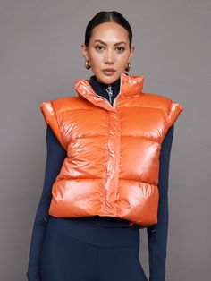 Puffer Vest - Orange Sporty Vest Outerwear For Fall, Functional Fitted Vest For Fall, Functional Fitted Fall Vest, Sporty Sleeveless Puffer Vest, Trendy Nylon Vest For Fall, Fall Nylon Sleeveless Vest, Sleeveless Nylon Vest For Fall, Sporty Winter Vest, Sporty Fitted Vest For Fall