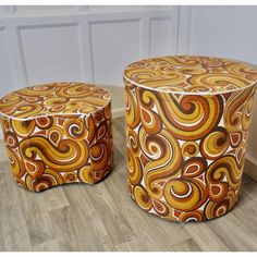 two stools sitting on top of a hard wood floor