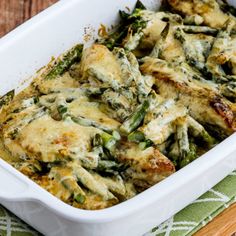 a casserole dish with asparagus and cheese