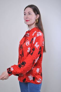 "Flowers print women retro red long sleeve blouse, Size XL Welcome to TARASCOMMON.ETSY.COM Unique clothing from the 20th century. Model tall - 170cm XL. Sleeve - 40cm / 15.74inch; ( armpit to end of sleeve); Width - 60cm / 23.62inch; Length - 65cm / 25.59inch. All measurements are taken seam to seam while lying flat. This item is vintage, so it can have some defects. Additional photos can be send We are glad that you are interested in lots that we sell. Wish you a good shopping! FOLLOW US : Inst Vintage Long Sleeve Blouse For Fall, Red Graphic Print Blouse For Fall, Long Sleeve Blouse For Fall Vintage Fashion, Long Sleeve Blouse For Vintage Fashion In Fall, Vintage Print Long Sleeve Tops, Spring Long Sleeve Blouse With Graphic Print, Long Sleeve Tops With Vintage Print, Long Sleeve Tops For Vintage Fashion, Vintage Red Long Sleeve Blouse