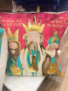 a decorative pillow with an image of three wise men on it and the words, we mean his in the east to worship