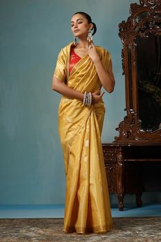 Light yellow gold handwoven saree crafted in kosa silk featuring flower and leaf motif. Comes with a running blouse piece. - Aza Fashions Elegant Yellow Pre-draped Saree With Zari Weaving, Gold Pre-draped Saree With Cutdana In Traditional Drape, Gold Raw Silk Pre-draped Saree For Festivals, Festive Gold Art Silk Pre-draped Saree, Transitional Gold Banarasi Silk Pre-draped Saree, Gold Handloom Pre-draped Saree For Wedding, Gold Pre-draped Saree For Puja And Festivals, Traditional Gold Pre-draped Saree For Navratri, Gold Pre-draped Saree With Cutdana For Navratri