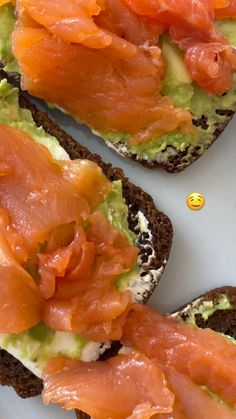 an open face sandwich with salmon and avocado