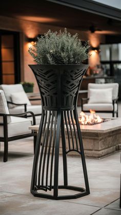 an outdoor fire pit in the middle of a patio