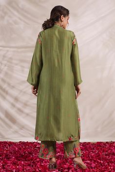 Green silk kurta with front gathered panel, multi color placement floral print, sequin, bead and French knot thread embroidered highlights. Paired with palazzo with printed border.
Components: 2
Pattern: Printed and Hand Embroidered
Type Of Work: Floral Print, Bead, Sequin and French Knot Thread Work
Neckline: V Neck
Sleeve Type: Full Sleeves
Fabric: Silk
Color: Green
Other Details: 
Embroidered yoke
Side slits
Embroidered highlights
Model height: 5ft inches, wearing size S
Note: Kindly contact Festive Silk Kurta With Printed Motifs, Silk Sets With Multicolor Embroidery In Straight Kurta Style, Silk Sets With Multicolor Embroidery And Straight Kurta, Festive Silk Palazzo Set With Floral Embroidery, Cotton Silk Lawn Suit With Mirror Work, Designer Slub Silk Kurta With Floral Embroidery, Designer Silk Kurta With Printed Motifs, Silk Straight Kurta With Printed Motifs, Floral Embroidered Slub Silk Kurta For Designer Wear