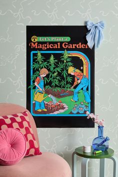 a children's book about the magic garden hanging on a wall next to a pink chair