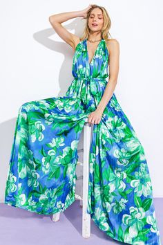 A printed woven jumpsuit featuring V halter neckline, sleeveless, self sash tie, wide leg, bare back with neck tieDetails:Self: 97% Polyester 3% SpandexLining : 100% Polyester Size & Fit- Model is 5`8" And Wearing Size Small- Measurements Taken From Size Small- Approx. Length: 63" Spring Green Tie Back Jumpsuits And Rompers, Blue Maxi Length Jumpsuits And Rompers For Spring, Spring Green Jumpsuit With Tie Back, Blue Maxi Length Jumpsuits For Spring, Spring Green Jumpsuits And Rompers With Tie Back, Spring Maxi Length Jumpsuits And Rompers With Tie Back, Summer Halter Neck Jumpsuit With Tie Back, Green Halter Neck Jumpsuit For Beach, Spring Halter Neck Jumpsuit With Tie Back