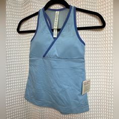 New With Tags, Light Blue Workout Tank With Built In Bra. Two Toned Blue. Size 4 Light Blue Stretch Top For Gym, Moisture-wicking Light Blue Workout Top, Functional Blue Racerback Tops, Blue Sleeveless Go-dry Activewear, Sleeveless Blue Go-dry Activewear, Blue Fitted Racerback Activewear, Blue Moisture-wicking Tops For Light Exercise, Light Blue Stretch Sports Tops, Light Blue Stretch Tops For Sports