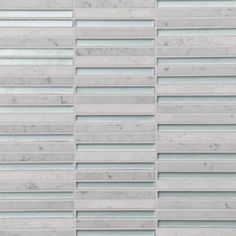 a white marble tile wall with vertical lines