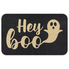 a door mat that says hey boo with a ghost in the middle and a black background