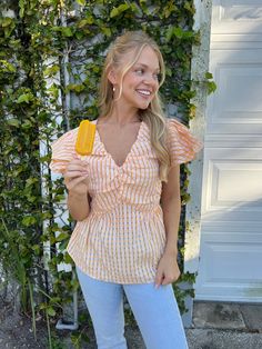 Our Tangerine Gingham Ruffle Top is so girly and fun for the spring/summer season! Featuring a v-neckline, ruffle sleeves, and shirring detail. lined bust stretchy back detail 100% polyester care instructions: hand wash cold slightly oversized, relaxed fit Sarah is 5'3" wearing a small Spring Gingham V-neck Top, Summer Ruffles Top For Picnic, Gingham V-neck Tops For Spring, Summer Gingham V-neck Top, Summer V-neck Top For Picnic, Gingham V-neck Top For Day Out, Ruffle Sleeves, Ruffle Top, Dress Romper