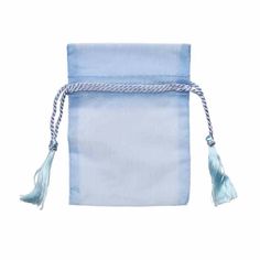 a small blue bag with tassels on it