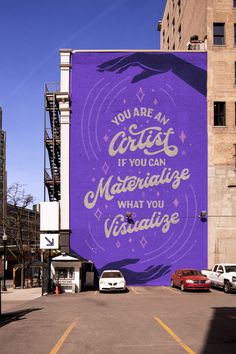 a large purple sign on the side of a building that says you are an artist if you can materialize what you violate