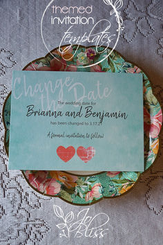 a plate that has some type of wedding card on it with flowers and hearts in the middle