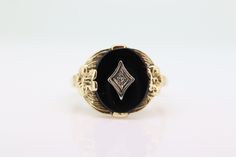 Rare Onyx and Diamond ring. 10k Gold.  2.8grams total 10mm by 12mm oval Onyx 1.5mm diamond in center size 7.25 Oval Onyx Jewelry For Anniversary, Oval Onyx Wedding Ring, Oval Onyx Rings For Anniversary, Formal Oval Onyx Jewelry, Formal Oval Signet Ring With Diamond Accents, Oval Signet Ring With Diamond Accents For Formal Occasion, Classic Jewelry With Diamond Accents And Oval Cabochon, Classic Oval Cabochon Jewelry With Diamond Accents, Fine Jewelry Onyx Oval Ring