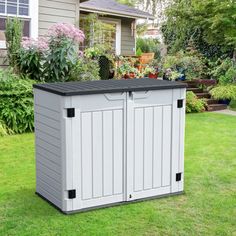 an outdoor storage shed in the yard