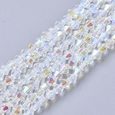 a close up shot of the beaded edge of a white and multicolored bracelet