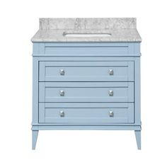 an image of a blue vanity with marble counter top and drawers on the bottom shelf