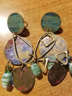 Copper Patina 3 inch Dangle Earrings with Multi colors of Blue-green, Lavender, Purple and Rose; Disc shape with bronze and multi color bead embellishments Patina Metal, Green Lavender, Copper Patina, Lavender Purple, Jewelry Earrings Dangle, Patina, Embellishments, Dangle Drop Earrings, Violet