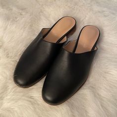 Brand New. Never Worn. Leather Upper Modern Black Flats For Everyday, Modern Black Everyday Flats, Classic Closed Toe Mules For Everyday, Classic Black Everyday Flats, Open Toe Black Flats For Work, Classic Flat Mules For Fall, Black Open Toe Flats For Work, Black Leather Footbed Flats For Spring, Chic Everyday Mules With Round Toe