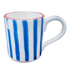 a blue and white striped coffee cup on a white background with red trimmings