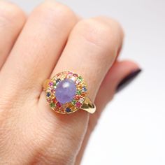 Adding some really fun affordable items to the shop for a quick pick-me-up or holiday present. This piece is super colorful with a lovely purple hazy tanzanite cabochon surrounded by a rainbow of tourmalines. Ring face measures approx. 15m x 14mm. Ring size 7.25. Setting is gold vermeil (gold over sterling silver). Fine Jewelry Multicolor Cabochon Gemstones, Multicolor Cabochon Gemstones Fine Jewelry, Multicolor Cabochon Gemstones For Fine Jewelry, Multicolor Oval Sapphire Ring, Multicolor Round Sapphire Gemstones, Multicolor Amethyst Ring Fine Jewelry, Multicolor Amethyst Gemstone Ring, Multicolor Oval Amethyst Ring With Gemstone Accents, Multicolor Oval Amethyst Ring With Accent Stones