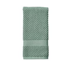 a green towel on a white background