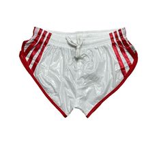 a pair of white and red shorts with stripes on the bottom, tied to one side