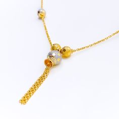 This fancy 22k gold necklace features a striking multi-color design, blending yellow and white gold for a unique and elegant look. Weighing 9.1 grams, it offers a luxurious yet comfortable feel. The radiant combination of yellow and white gold enhances its modern and sophisticated appeal. With a necklace length of 18 inches and a drop length of 1.5 inches, this piece is perfect for adding a touch of refined style to any outfit. The secure lobster lock ensures confident and comfortable wear. Elev Dual-tone Gold Plated Necklace, Elegant Multicolor 22k Gold Necklaces, Gold Dual-tone Necklace For Gift, Dual-tone Gold Necklace For Gift, Elegant Gold Dual-tone Necklace, Elegant Dual-tone Gold Necklace, Dual-tone 22k Yellow Gold Necklaces, 22k Dual-tone Yellow Gold Necklaces, Elegant Dual-tone Yellow Gold Necklace